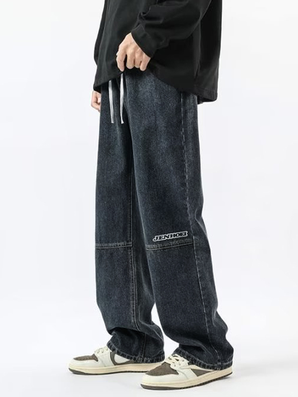 Lose Herrenjeans mit Buchstabenstickerei und Kordelzug