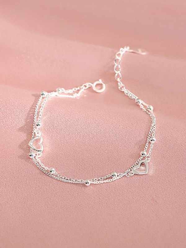 Doppellagiges Silberarmband mit Herzmuster